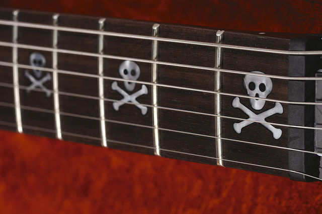 Skull fret markers, for metal kids only.